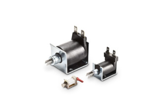 Three different sizes of solenoids ranging from large to small